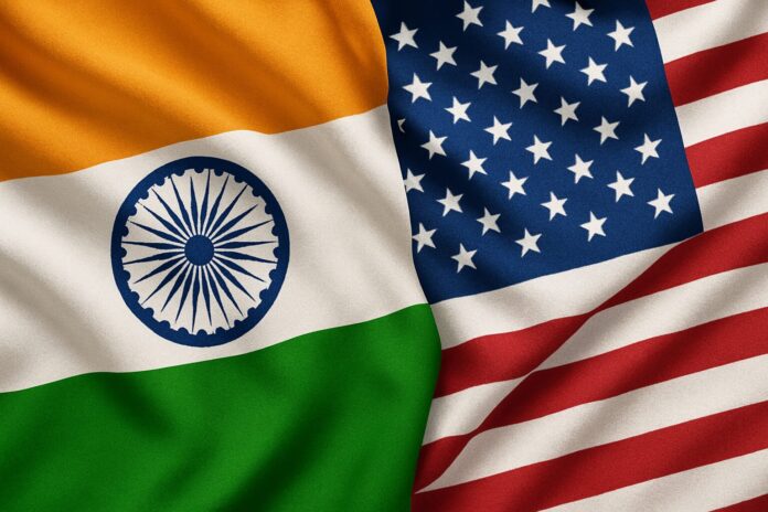 Intertwined American and Indian flags waving together, symbolizing U.S.–India partnership.